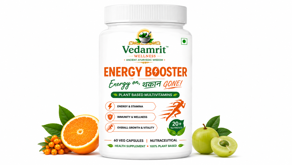 A white bottle of Vedamrit Wellness Energy Booster plant-based multivitamin, flanked by fresh orange slices, orange berries, and green apples on a clean white background.