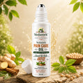 Vedamrit Pain Care Oil bottle with natural ingredients on a wooden surface